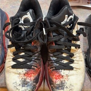 Nike Black and Red Athletic Shoes with Distinctive Design